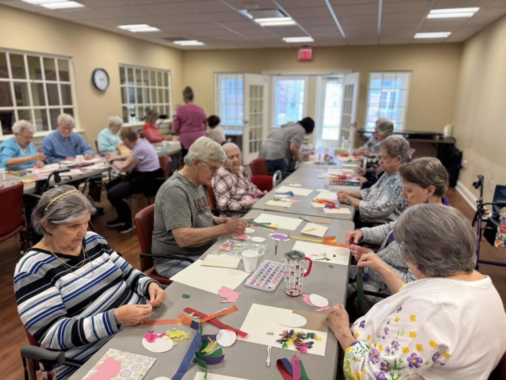 Seniors experiment with tissue paper art at the Village at Woods Edge.