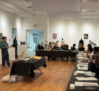 Spencer Tinkham teaches Art Outreach Students