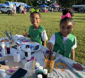 Girl Scouts painting at Derby Day.