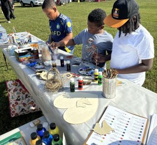 Youth enjoying art at Derby Day.